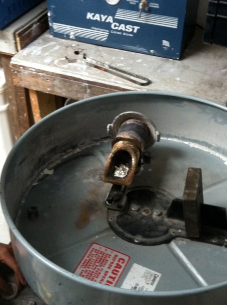 The plaster mould and the crucible full of silver are placed in the centrifuge.