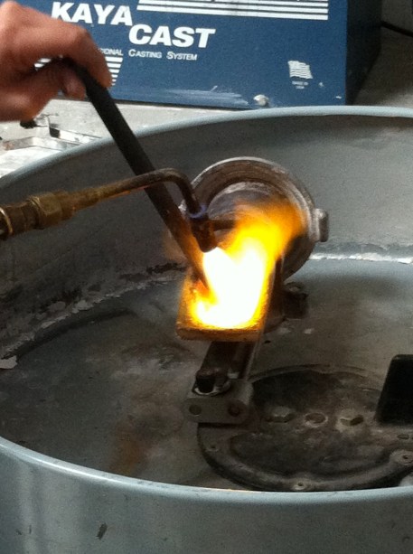 Melting the silver with a blowtorch.
