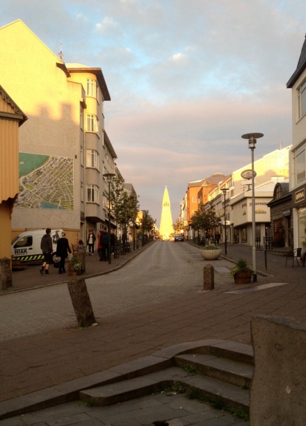 A view up one of Reykjavik's downtown streets, looking at the Hallgrimskirkja reflected in the near-midnight sun.