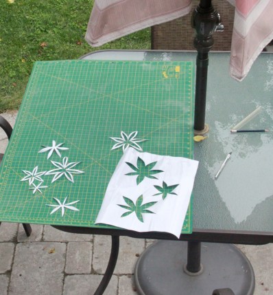 Cutting the flower motif out of mac-tac...in my 'outdoor studio'