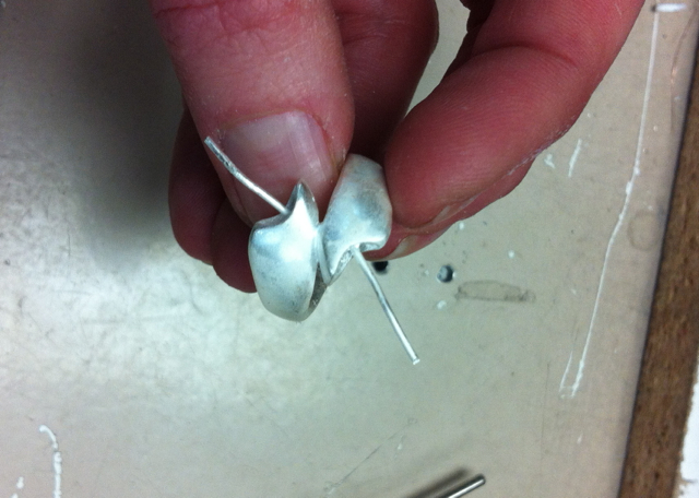 The ring after casting. Ive soldered wires in place which will hold the pearls.