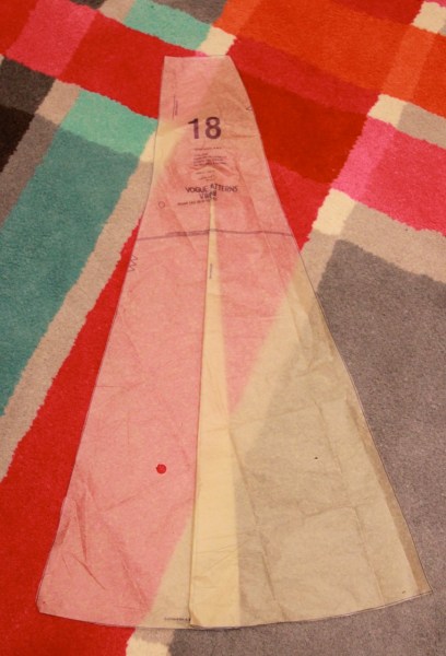 I folded out a triangular slice of each skirt panel piece to reduce the overall fullness of the skirt. I folded from where the panel starts to flare down to the hem.