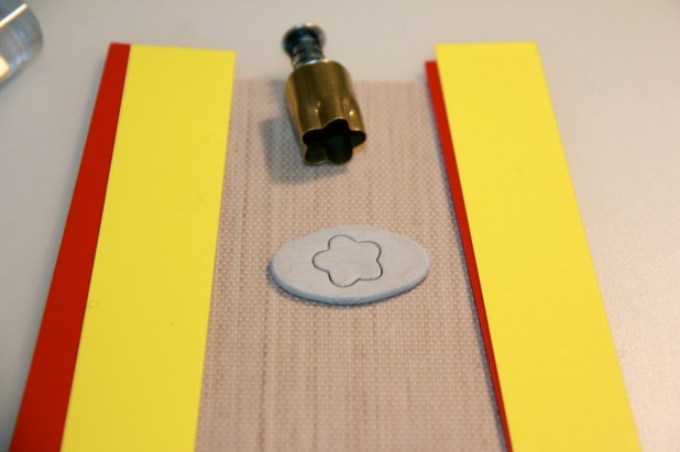 Here I've used a flower shape cutter from XXXX. The edge of the cutter should be oiled with olive or coconut oil to prevent sticking.