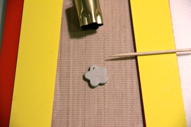 I use a toothpick to create a hole for the jump ring