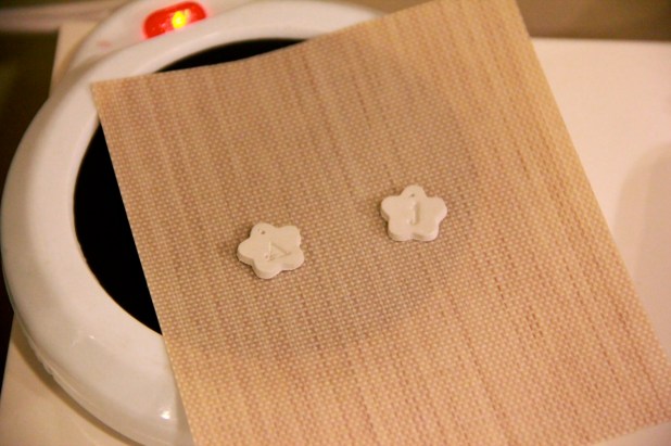 Silver clay pieces drying on a mug warmer